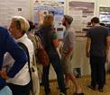 PRIMO attendees discuss poster presentation